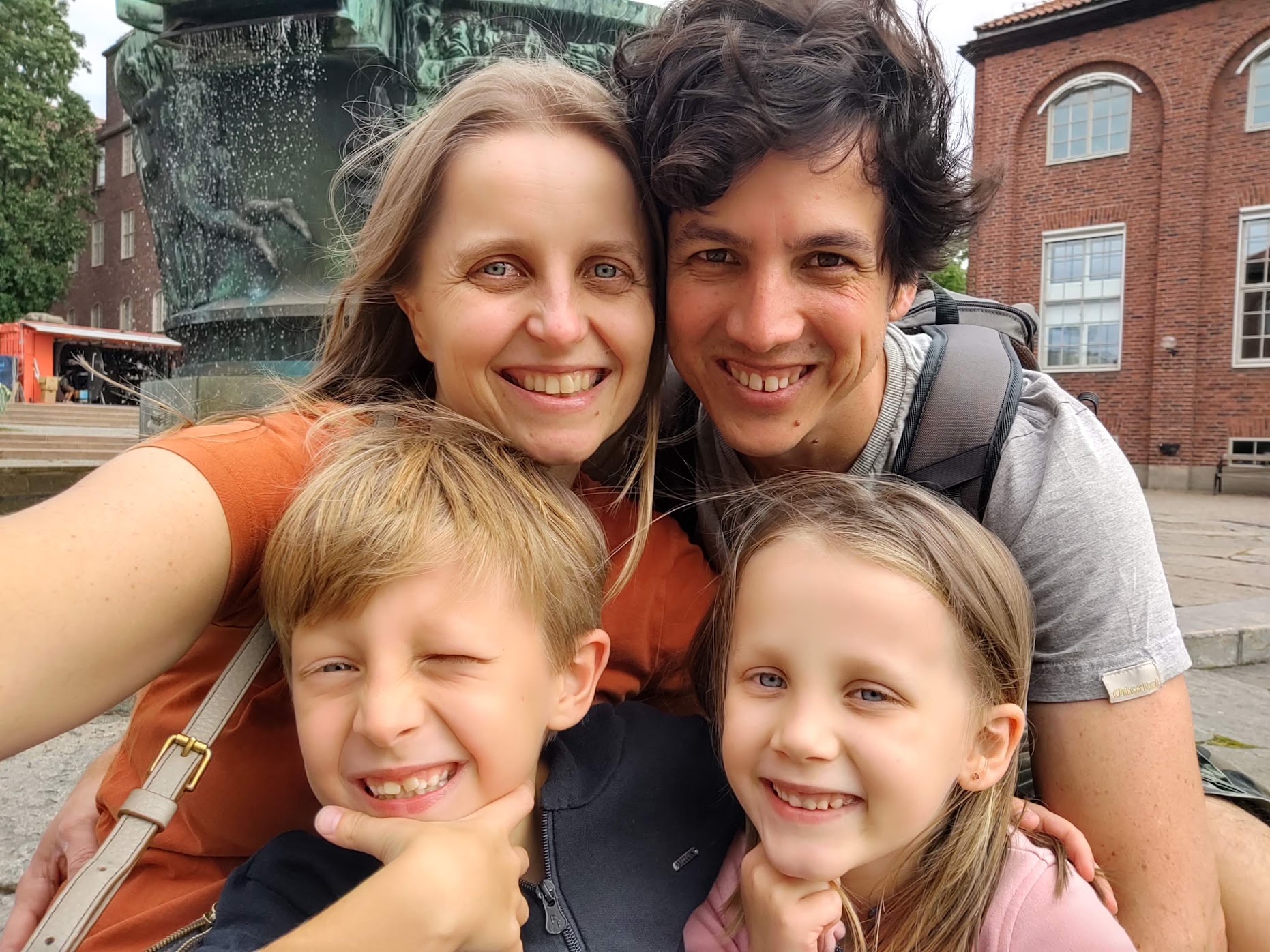 A picture of my two kids -- a boy and a girl --,my wife and me.